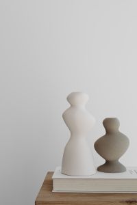 Kaboompics - Neutral Ceramic Vases and Art Book Styled on Oak Furniture