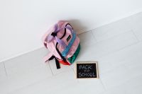 Kaboompics - Pink Backpack and Back to School Chalkboard on White Floor