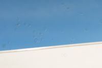 Kaboompics - Soap Bubbles against Blue Sky and a White Building Edge