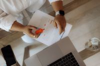 Kaboompics - Overhead View of Black Woman Reviewing a Document