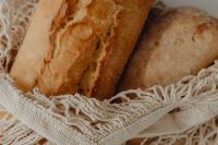 Kaboompics - Golden Ciabatta Crust and Mesh Bag Texture Close-Up