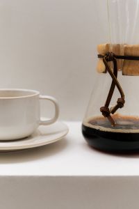 Kaboompics - Close Up of White Coffee Cup and Glass Chemex