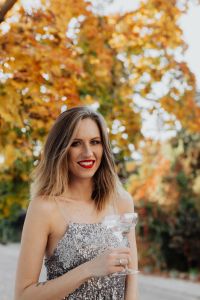 Kaboompics - Autumn Champagne Portrait of Smiling Woman in Silver Dress