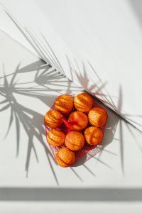 Kaboompics - Bright White Citrus Background with Layered Palm Shadows and Bag at Lower Edge