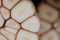 Kaboompics - Sliced Garlic on White Marble with Copy Space