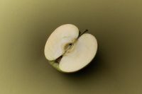 Kaboompics - Sliced Apple on Olive Green Background