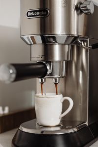Kaboompics - Espresso Pouring into a Textured White Mug