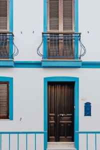 Kaboompics - White Mediterranean Facade with Blue Trim and Wooden Door