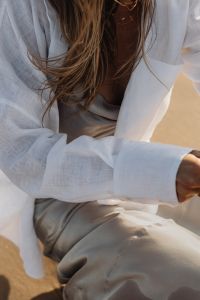 Kaboompics - Woman Wearing Sunglasses in White Shirt on Beach