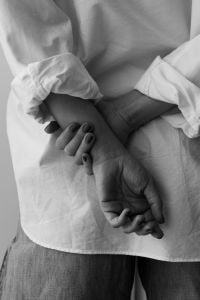 Kaboompics - Hands Resting Behind the Back in Black and White Portrait