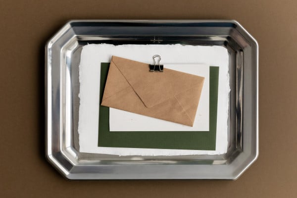 Kraft Paper Envelope on Silver Tray with Green Card. Ideal for ...