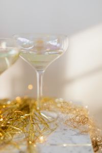 Kaboompics - Close-Up of Sparkling Champagne Glass and Gold Decor