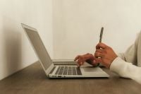 Kaboompics - Female Hands Typing on Laptop While Holding Pen