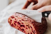 Kaboompics - Knife Slicing Beetroot Bread with Pink Crumb