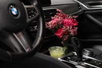 Kaboompics - Autumn Flowers and Iced Matcha in a Car Interior