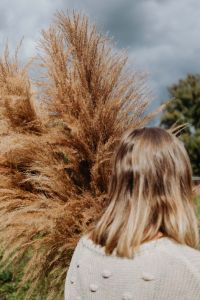 Kaboompics - Close-Up of Pampas Plumes beside a Woman in a Greenhouse