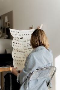 Kaboompics - Close-Up of Designer Studying Architectural Furniture Catalog