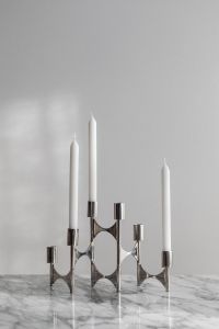 Kaboompics - Chrome Candelabra with White Candles on Arabescato Marble