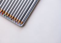 Kaboompics - Colorful Pencil Set in a Silver Case With Copy Space