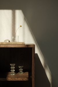 Kaboompics - Minimalist Shelf Styling with Glass Decor and Window Shadows
