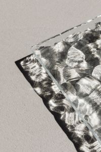 Kaboompics - Faceted Glass Sheet Casting a High-Contrast Shadow on Pale Ground