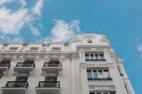 Kaboompics - Ornate White Madrid Facade with Sculpted Pediment and Decorative Cornice