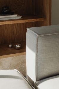 Kaboompics - Grey sofa and oak bookshelf with silver objects