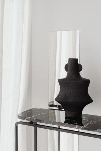 Kaboompics - Close Up Black Sculptural Vase On Marble Console
