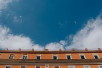 Kaboompics - Upward View of an Orange Naples Building Beneath Blue Sky