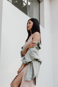 Kaboompics - Side Profile Woman in Pale Dress with Jacket Draped over Shoulders