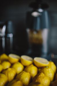 Kaboompics - Soft-Focus Lemons Along the Bottom Edge with Dark Negative Space, Minimal Vertical Citrus Background for Summer Design