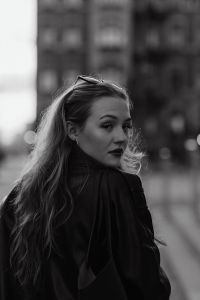 Kaboompics - Black and White Street Portrait of Woman Looking Back