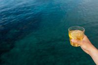 Kaboompics - Close-Up Yellow Drink against Dark Seawater