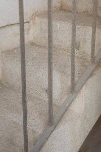 Kaboompics - Pale Terrazzo Staircase behind Simple Metal Railing