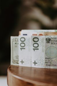 Kaboompics - Upright Polish Zloty, Euro and US Dollar Banknotes with Soft Focus Background