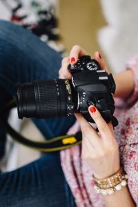 Woman in pink with her camera