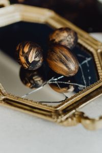 Kaboompics - Painted Easter Eggs Reflected in a Vintage Gold Mirror Tray