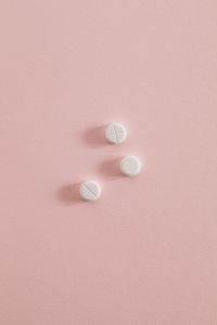 Kaboompics - Three White Tablets on a Pink Background
