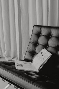 Kaboompics - Black-and-White Reading Nook with Open Book on Barcelona Chair