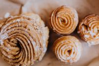 Kaboompics - Macro Close-Up of Sugar-Dusted Spiral Polish Donuts, Fat Thursday Treat