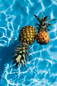 Kaboompics - Pineapple in a swimming pool