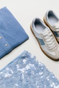 Kaboompics - Blue Polo Shirt, White Sneakers and Sequins Flat Lay