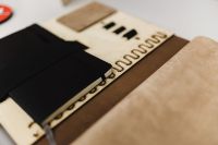 Kaboompics - Leather Portfolio with Black and Tan Material Swatches, Close-Up of Architectural Design Samples