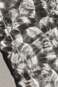 Kaboompics - Macro of Irregular Faceted Glass Texture in Silver and Charcoal