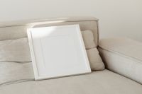 Kaboompics - Angled Square Photo Frame Mockup on Neutral Upholstery