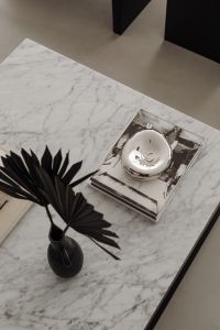 Kaboompics - Black Leaf Vase and Candle on a Marble Coffee Table