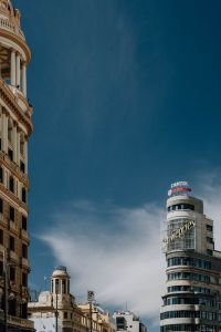 Kaboompics - Madrid Skyline Framed by Historic Facade with Capitol and Schweppes Signs
