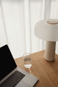 Kaboompics - Travertine Lamp and Water Glass in Natural Window Light