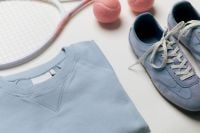 Kaboompics - Blue Shirt, Sneakers, Tennis Racket and Pink Balls Flat Lay