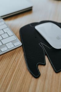Apple iMac Home Office Setup with Keyboard, Mouse, Elephant-Shaped Mouse Pad and Wooden Desk